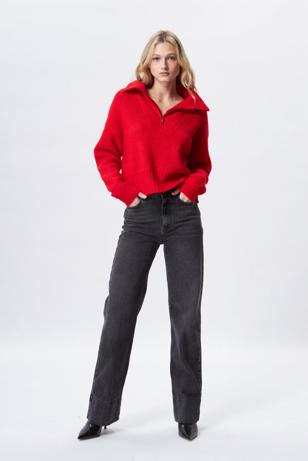 From John and Jenn the style Atlas is a cosy zipper front ribbed knit. Available in red. Stylish, comfortable, cozy and casual.  Perfect for work and also after ski sweater. Available at REDVELVET clothing for women online boutique