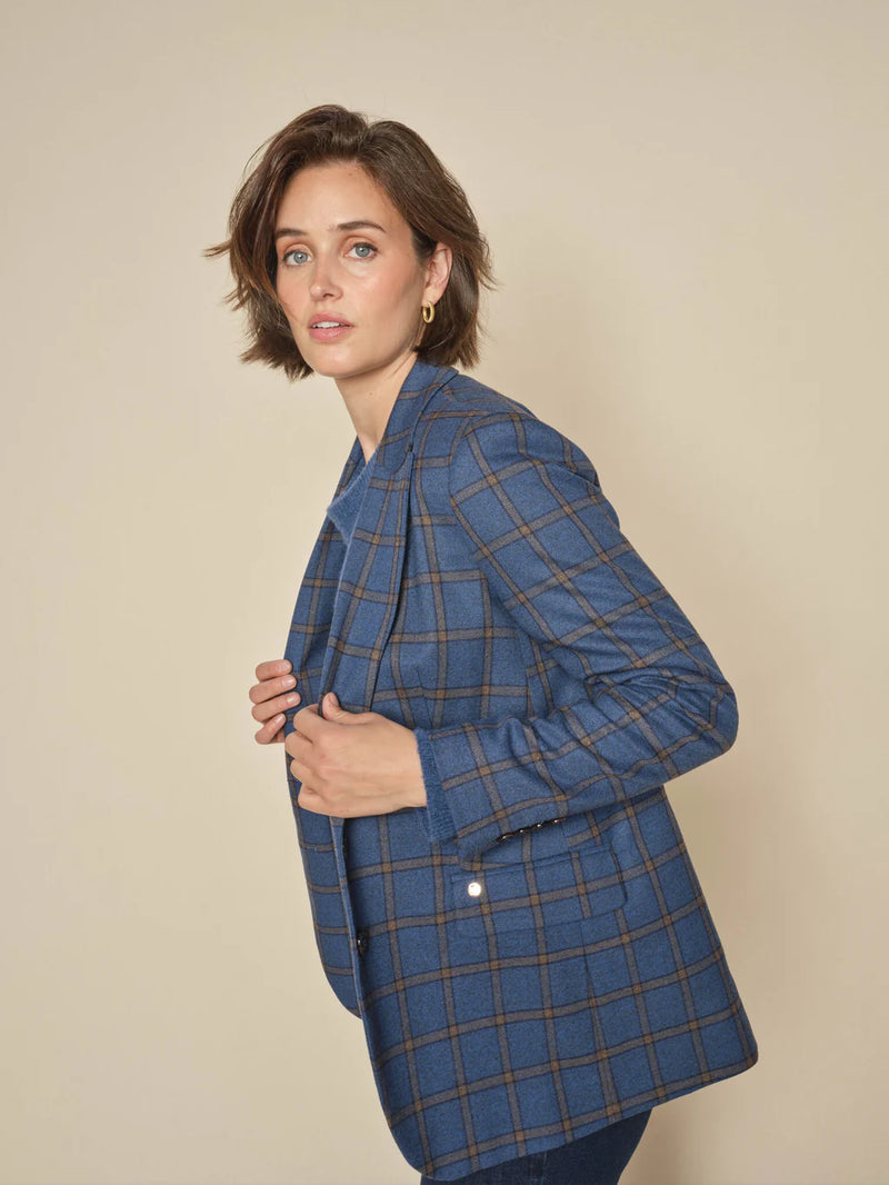 from Mos Mosh, Elegant check blazer, tailored in a relaxed, elongated silhouette. Featuring double-button closure, rounded hem, and flap pockets. Versatile enough to elevate any jeans-and-tee outfit with effortless style.