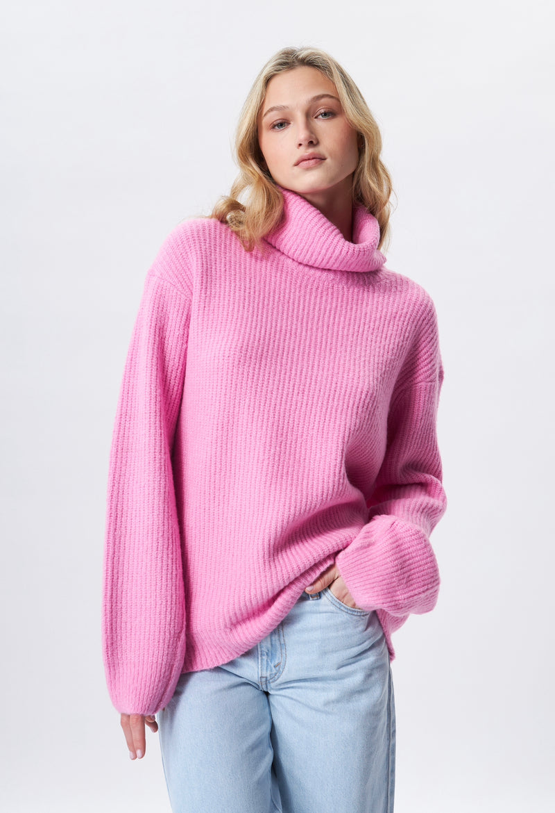 Fashion oversized turtle neck sweater in a fine ribbed knit.  Avalable at REDVELVET in pink