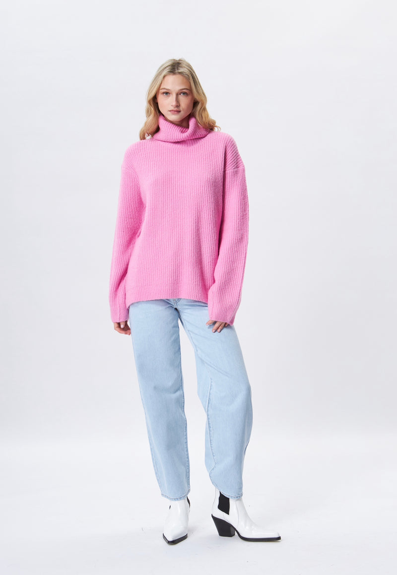 Fashion oversized turtle neck sweater in a fine ribbed knit.  Avalable at REDVELVET in pink